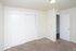 Bedroom with a wide double-door closet at Fairbrook in Salt Lake City, UT