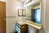 Bathroom vanity with large mirror at Hickory Forest in Memphis, TN