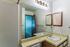 Second bathroom with vanity and mirror at Hickory Forest in Memphis, TN