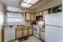 Model kitchen with white appliances at Hickory Forest in Memphis, TN