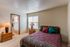 Furnished model bedroom with queen bed at Hickory Forest in Memphis, TN