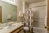 Model bathroom with tub and floral curtain at Hickory Forest in Memphis, TN