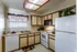 Model kitchen with white appliances at Hickory Forest in Memphis, TN