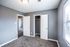 Bedroom with two closets and carpet at Jackson Heights Residential in West Memphis, AR