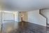 Spacious 3 bedroom living area with stairs and wood-style floors at Shadowbrook Townhomes in Memphis, TN