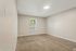 Carpeted primary bedroom with a bright window at Shadowbrook Townhomes in Memphis, TN