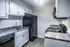 1 bedroom kitchen with granite counters and black appliances at The Meadows Apartments in Memphis, TN