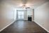 1 bedroom living room with wood-style floors and ceiling fan at The Meadows Apartments in Memphis, TN
