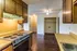 Kitchen with wood cabinets and a range hood at Hickory Pointe in Memphis, TN