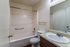 Bathroom with a tub-shower and wood vanity at Hickory Pointe in Memphis, TN
