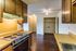 Kitchen with wood cabinets and a range hood at Hickory Pointe in Memphis, TN