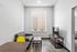 Contemporary living room featuring sleek gray sofa, vibrant yellow chair, and modern TV stand, perfect for urban living.