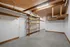 Attached garage with ample storage space and workshop