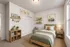 Charming seond bedroom with plush carpets, closet, and large window with natural light.