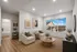 Bright, elegant living room sleek plank floors, and a breathtaking view through a large window.