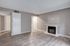 Large living room with wood burning fireplace.