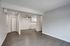 Open living room with upgraded flooring throughout