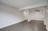 Open living room with upgraded flooring throughout