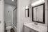 Renovated bathroom with quartz countertops