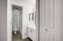 Renovated bathroom with quartz countertops