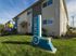 Exterior of Elements at 1600 two story building with baloons and monument sign on the lawn.