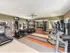 State of the art fitness center with 6 cardio machines and 4 weight machines, along with 3 mount tvs for enjoyment, all on top of rubber flooring.