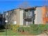 Building exterior showing our baloney's and patios along with lush landscaping.