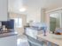 2 bedroom decorated remodeled kitchen view with a slight dining room image