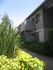 Exterior building with bright green landscaping.