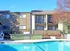 Refreshing swimming pool with built in stainless steel BBQ with our back ground.