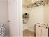 Walk in closet with multi level hanging options.
