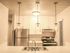 Kitchen with stainless steel appliances and modern finishes.