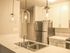 Kitchen with stainless steel appliances and modern finishes.