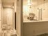 Front door and hallway leading to kitchen and dining room.
