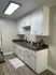 Large kitchen with white cabinets