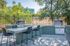 Dual bbq stations on with extended counter tops and bar stools at the pool area.