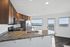 Kitchen with stone slab counters and views
