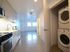 Entry with stacked washer and dryer