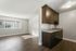brown cabinets, kitchen with sink and dishwasher, vinyl flooring, window