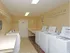 washer and dryers inside of laundry room