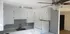 grey walls, white cabinets, white fridge