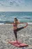 woman doing yoga on the beach