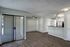 Dining room area leading into the kitchen with dining room window and multiple outlets apparent.