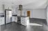 Kitchen with stainless steel appliances and white cabinetry.