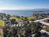 Aerial view of neighborhood and ocean.