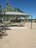 A spacious shade structure providing shelter at Blacklidge Flats. A perfect picnic area, complete with benches.