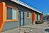 Blacklidge Flats building with vibrant orange trim on its exterior.