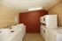 A laundry room with washers and dryers
