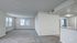 Spacious apartment with carpet and plank flooring and large windows