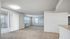 Spacious apartment with carpet and plank flooring and large windows